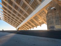 this is the underside of a bridge on a sunny day and it is not overcast, though