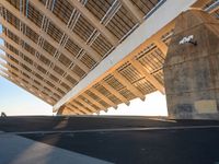 this is the underside of a bridge on a sunny day and it is not overcast, though