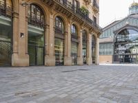 the stone floor is empty and clean with no people or vehicles around it in this building