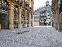 the stone floor is empty and clean with no people or vehicles around it in this building