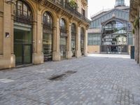 the stone floor is empty and clean with no people or vehicles around it in this building