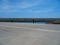 Barcelona's Clear Sky: Ocean Views from the Pier and Jetty