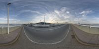 an intersection near a beach and ocean is shown in this fish eye view by 360 - dolly