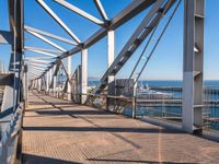 the railing is made of metal and features many different types of angles to it, which makes it a very interesting structure