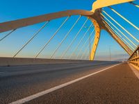 a highway with two lane overpasss leading from the top to the bottom and a bright blue sky