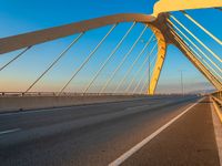 a highway with two lane overpasss leading from the top to the bottom and a bright blue sky