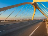 a highway with two lane overpasss leading from the top to the bottom and a bright blue sky