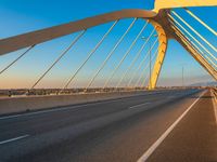 a highway with two lane overpasss leading from the top to the bottom and a bright blue sky