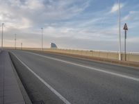 Barcelona at Dawn: A Bridge Connecting Modern Architecture and Roads