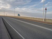 Barcelona at Dawn: A Bridge Connecting Modern Architecture and Roads