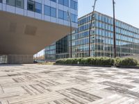 this is an outdoor building on a sunny day with an empty cobblestone road