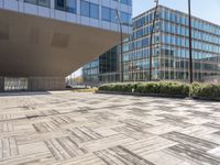 this is an outdoor building on a sunny day with an empty cobblestone road