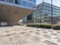 this is an outdoor building on a sunny day with an empty cobblestone road