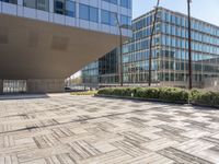 this is an outdoor building on a sunny day with an empty cobblestone road