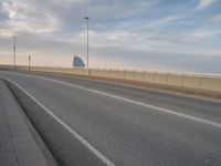 Barcelona's Modern Bridge: A Majestic View of the Coastal Skyline