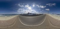 a reflection of a ship in the mirror on a beach road with other boats nearby