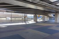 the underside of an overpass leading to a terminal terminal area with no cars or cars