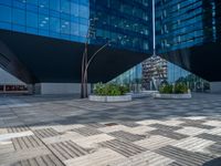 a white building next to a pool in a courtyard area with a walkway leading into it