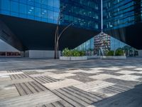 a white building next to a pool in a courtyard area with a walkway leading into it