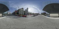 an upside down image of the road in front of some buildings and the cars are driving on it