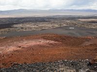 a barren landscape is shown in this image - - - including rocks, sand and dirt