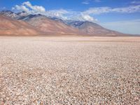 Barren Landscape: Beige Sand, Dirt, and Mountains