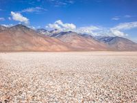 Barren Landscape: Beige Sand, Dirt, and Mountains