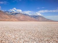 Barren Landscape: Beige Sand, Dirt, and Mountains