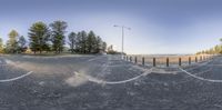 a view of a beach from a fisheye lens looking at the water below the sand