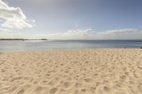 a picture taken from the beach looking out to the water and a lot of sand