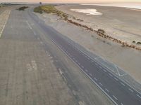 the beach road in the morning with some white markings painted on it's side