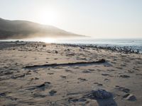 the sunlight shines brightly on a beach and the sand looks like it could have been washed down in time