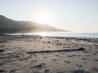 the sunlight shines brightly on a beach and the sand looks like it could have been washed down in time