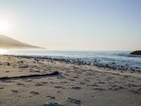 the sunlight shines brightly on a beach and the sand looks like it could have been washed down in time