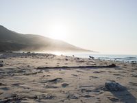 the sunlight shines brightly on a beach and the sand looks like it could have been washed down in time