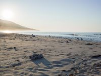 the sunlight shines brightly on a beach and the sand looks like it could have been washed down in time