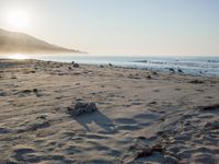 the sunlight shines brightly on a beach and the sand looks like it could have been washed down in time