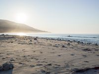 the sunlight shines brightly on a beach and the sand looks like it could have been washed down in time