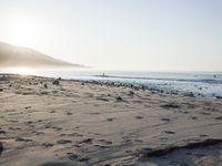 the sunlight shines brightly on a beach and the sand looks like it could have been washed down in time