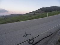 a bicycle is drawn onto the road with the help of chalk from a young rider