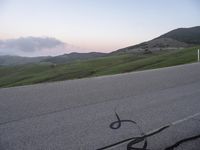 a bicycle is drawn onto the road with the help of chalk from a young rider