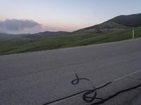 a bicycle is drawn onto the road with the help of chalk from a young rider