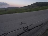 a bicycle is drawn onto the road with the help of chalk from a young rider