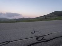 a bicycle is drawn onto the road with the help of chalk from a young rider