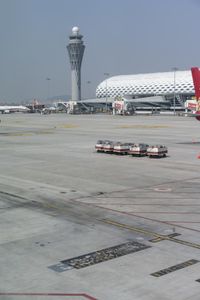 an image of airplanes on a runway being worked together outside the airport of an airport