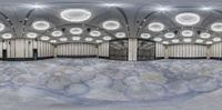 an indoor swimming area with tiled ceilings, marble flooring and stone walls, on a large mound of snow