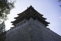 an ancient building with ornately carved roofing and decorative designs on it's sides