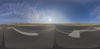 the view up at the sky shows an airplane in the middle of the runway, and one is painted onto the ground