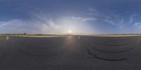 a plane is seen in this fish eye view of the tarmac on the runway