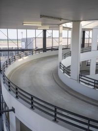 a very big curved concrete ramp with lots of stairs in it's middle levels